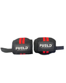 Pair of black wrist wraps with red straps and 'FUELD' branding on a reflective surface.