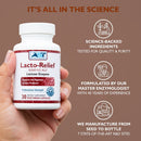Hand holding a bottle of Lacto-Relief supplement with branding and product details on a brown background.