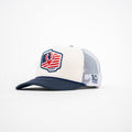Trucker hat with American flag design and '10 Years' logo on a white background