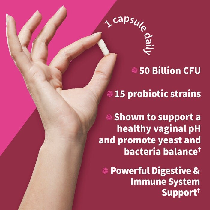 Hand holding a capsule with probiotic product information on a pink background