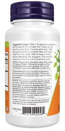 Back view of a white supplement bottle with a dark blue cap, showing the product instructions and warnings printed in black and orange text.