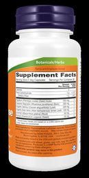 A supplement facts label on a white bottle with a purple cap. The label has an orange and green top band and reads 'Botanicals/Herbs' at the top, with a large Supplement Facts panel below listing ingredients such as flaxseed, chia seeds, spirulina, and turmeric.