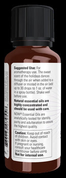 A small amber glass spray bottle with a black cap and a large white label showing suggested use, ingredients, and caution text.