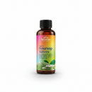 A bottle of Serene Herbs Exotic Soursop Bitters stands on a wooden table with a glass of water, a bowl of dark powder, and fresh soursop leaves and fruit in a softly blurred indoor setting.
