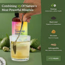 A hand holds a spoon over a glass of pale yellow liquid in front of a bottle labeled Soursop Bitters. The right side contains a dark green panel with text about ingredients including soursop, black seed, sea moss, ashwagandha, and a '+11 more' callout.
