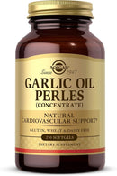 A bottle of Solgar Garlic Oil Perles (Concentrate) dietary supplement. The product is in an amber brown glass bottle with a gold screw cap and a gold label featuring black text.
