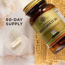 Solgar Men's Multi 50+ supplement bottle with a pill on a textured surface