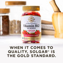SOLGAR Vitamin B12 Gummies bottle with text about quality on a white surface.