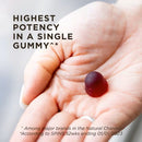 Hand holding a red gummy with text about potency in a single gummy.