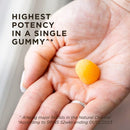 Hand holding a gummy with text about highest potency in a single gummy