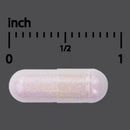 Capsule pill with a measurement scale in inches on a gray background