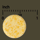 Yellow sponge with a measurement scale in inches on a dark background