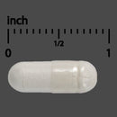 White capsule pill with measurement scale on a gray background